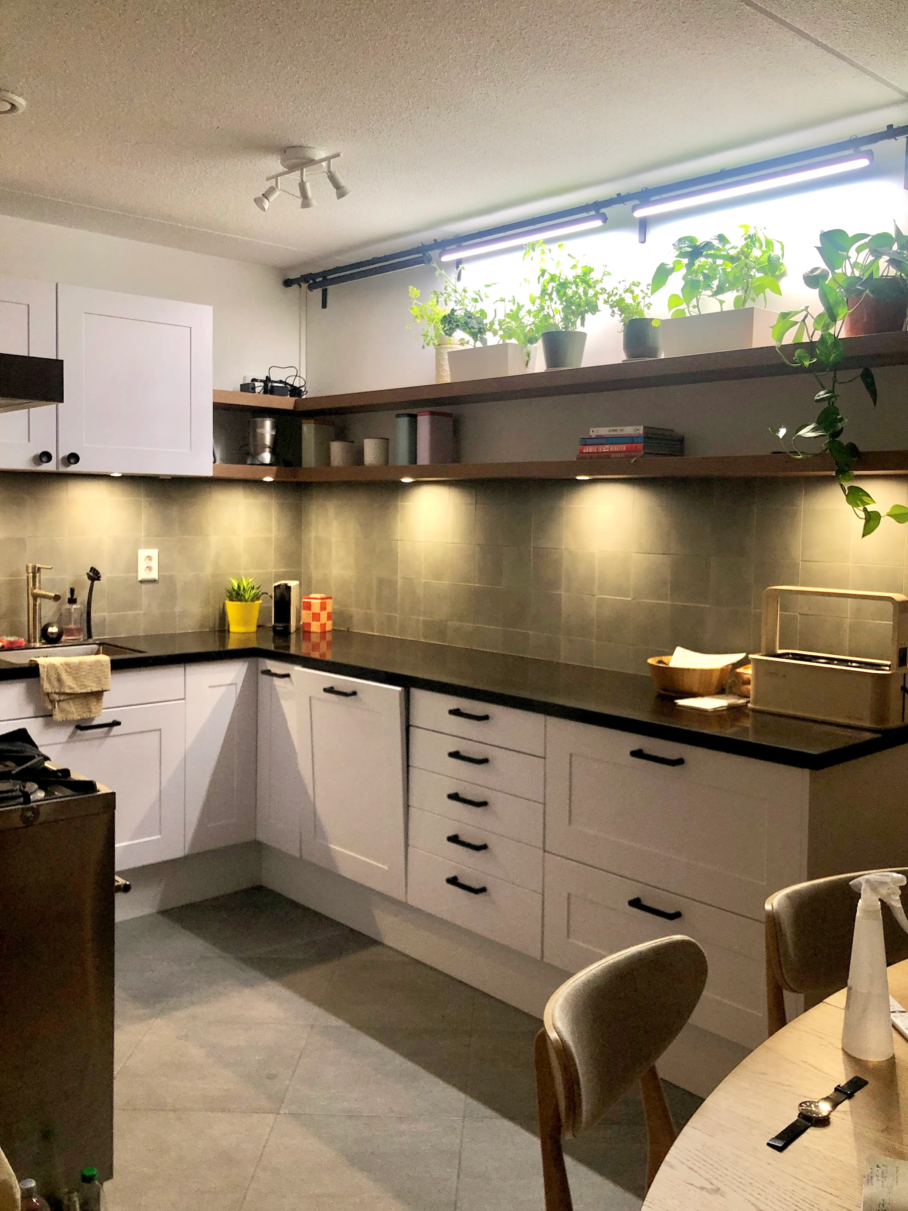 The right side of the kitchen.